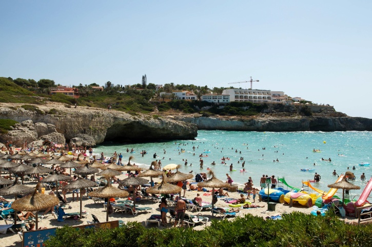 sandy beach, sunshades, ocean, tourist attraction